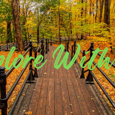 Autumn trees and wooden walkway with title of explore with us