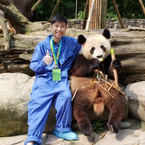 study abroad student with panda bear