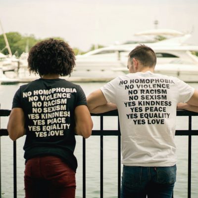 two men wearing anti-hate and for-love t-shirts