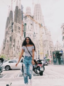 Student during summer study abroad in Spain, standing in front of Sagrada Familia, Barcelona, Spain.