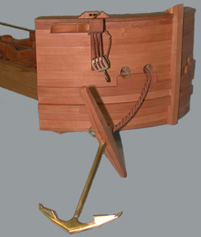 Bow of the ship, showing the cathead, hawse holes and anchor.