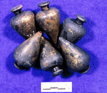 Examples of brass plumb bobs from the crate.