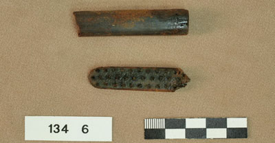 This small brush was likely used as a toothbrush. Several animal hair bristles were recovered from the holes in the head of the brush, and the head was made of animal bone.