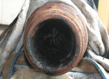 Bore of the carronade after the tompion is removed. The ball of ordage can be seen intact inside.