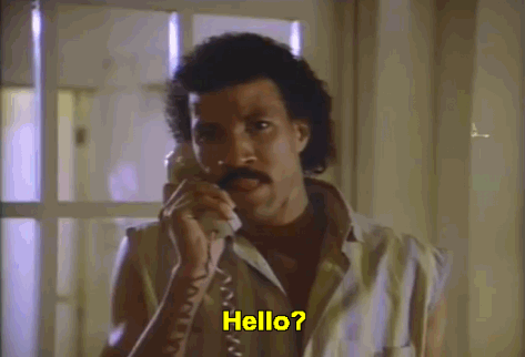 Gif of Lionel Richie's music video for the song "Hello," where whe says "Hello?" into the phone.