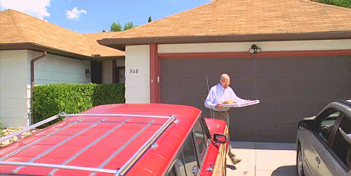 Gif of Walter White throwing a pizza on the roof.