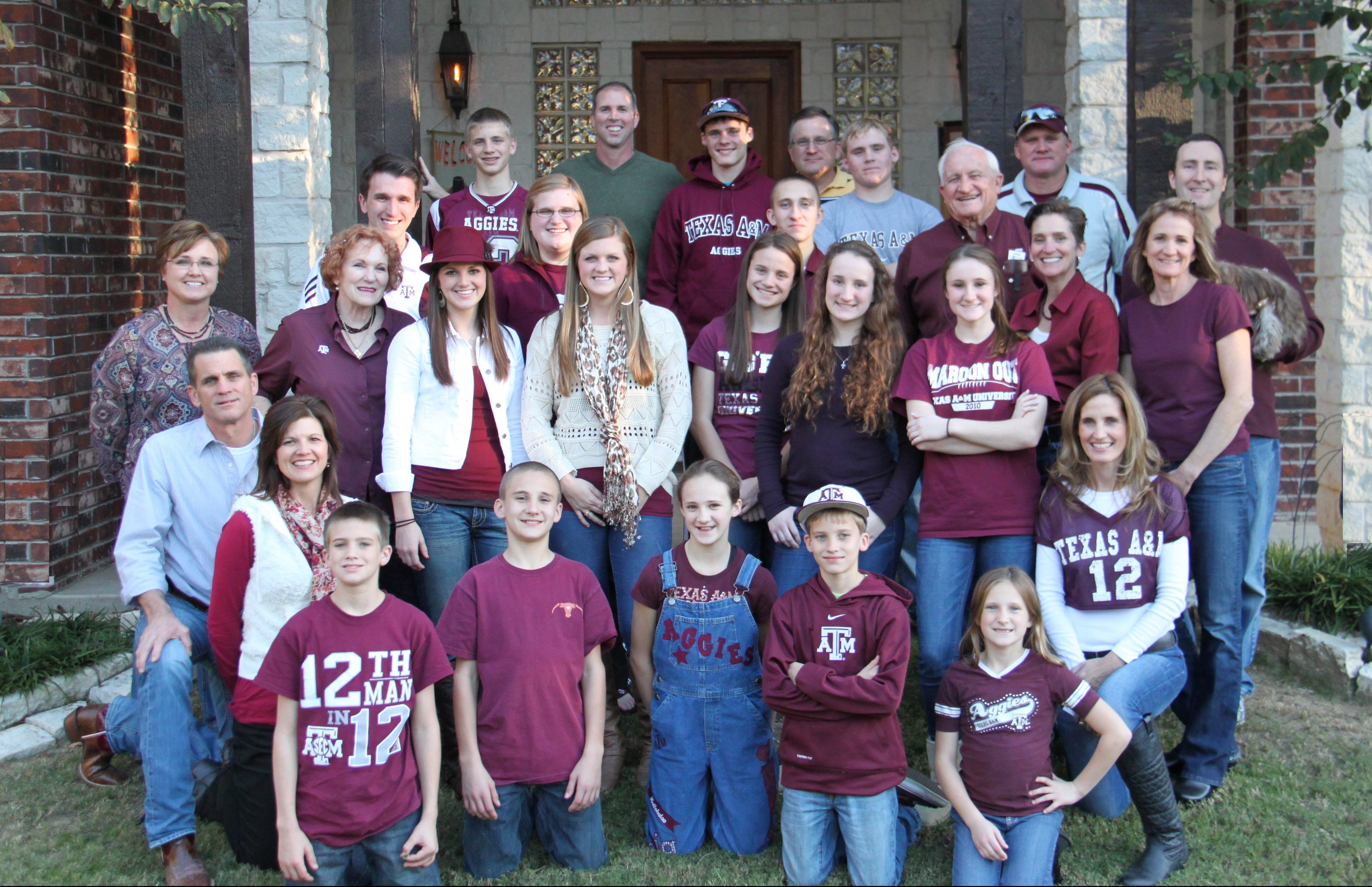 Sarah Hlavinka McConnell ‘86 and her large Aggie family, all wearing maroon.