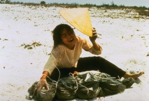 A grieving widow crying over plastic bag containing remains of husband, who was killed in February 1968, found in a mass grave near Hue. Credit Larry Burrows/The LIFE Picture Collection, via Getty Images