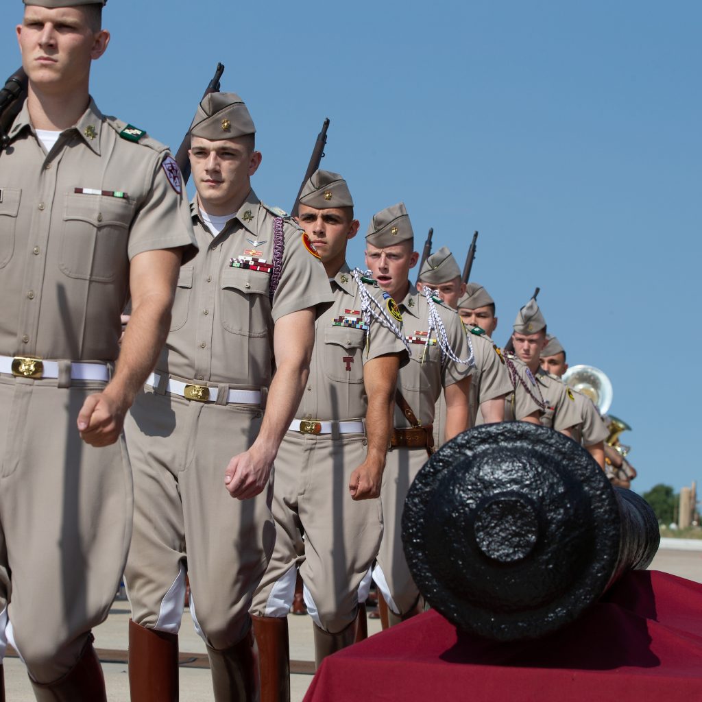 Photo of Corps of Cadets members alongside the cannon