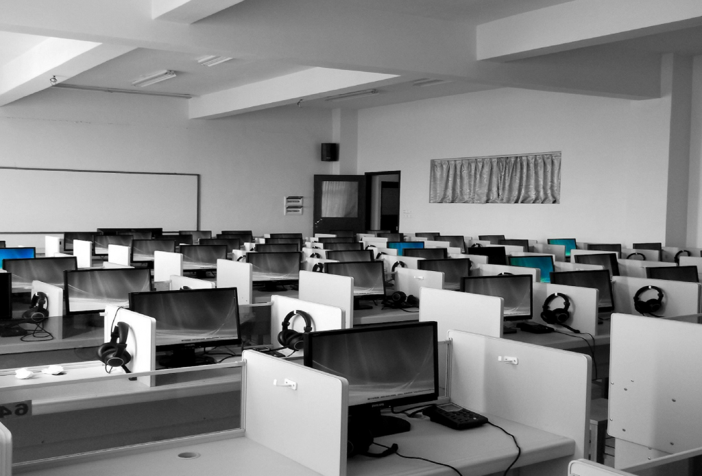 A computer lab with rows of computers
