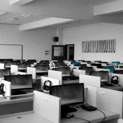 A computer lab with rows of computers