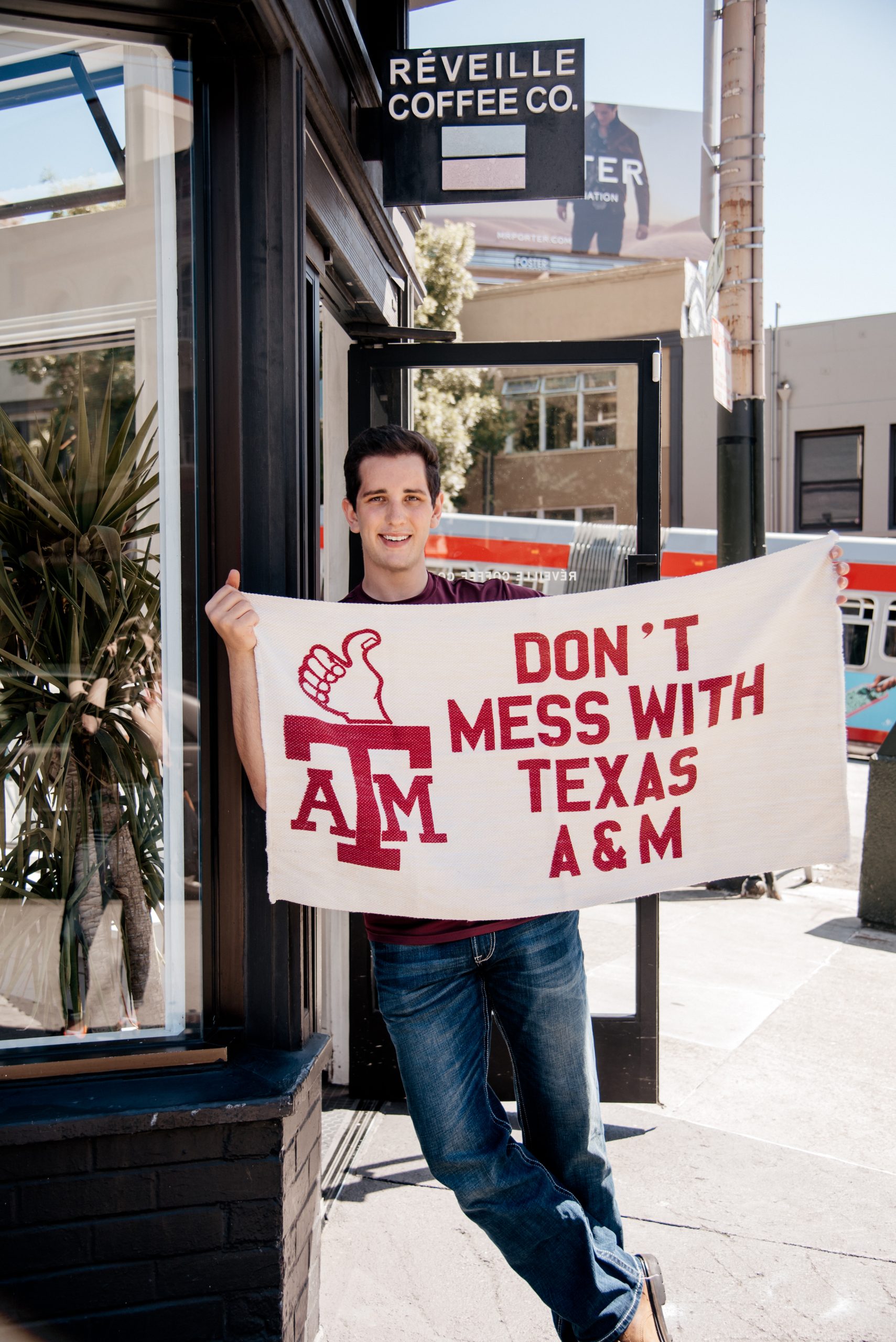 Cameron Hurta '20 shows his Aggie spirit by holding a, "Don't mess with Texas A&M" flag.