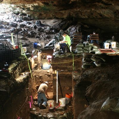 Photo of students excavating Halls Cave in Texas