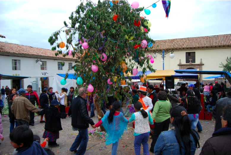 People gather and celebrate around the Yunza tree.