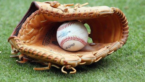 Photo of a baseball in a glove.