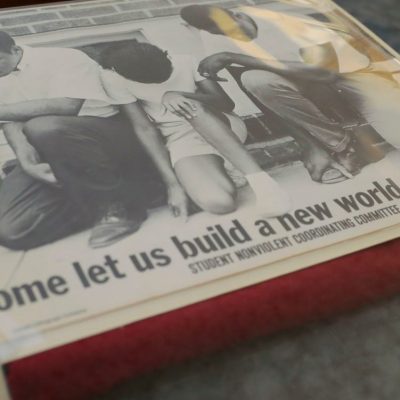Photo of a items, including a newspaper, from the Cushing Memorial Library & Archives.