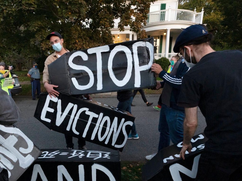People gather to protest evictions during the pandemic