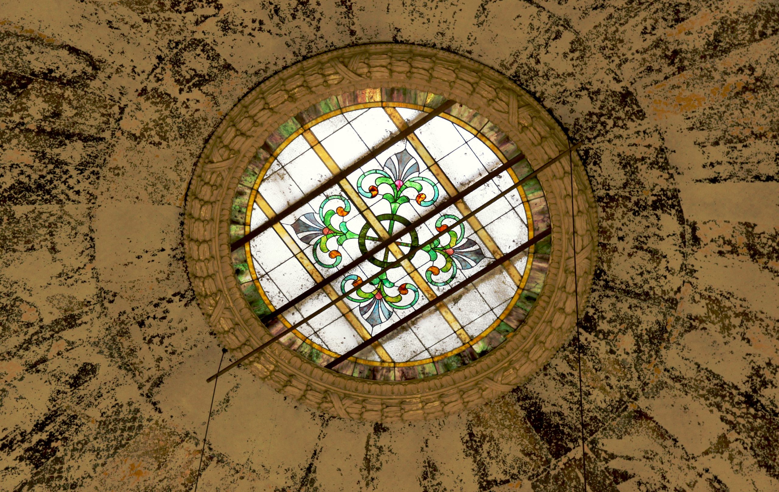 Photo of a stained glass skylight in a famous, old building on campus.