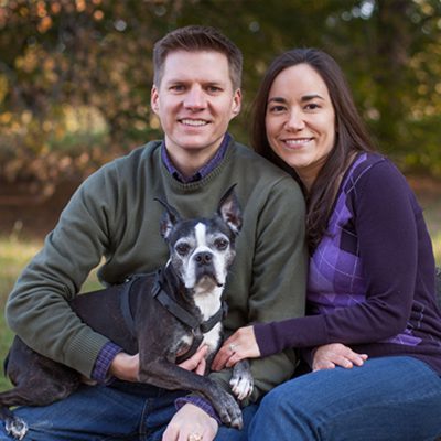 Photo of Ashley and Ryan Brus '04 and their dog.
