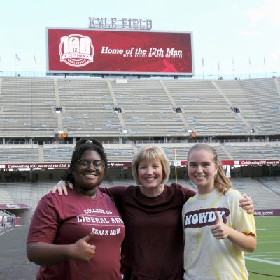 Charean on Kyle Field with College of Liberal Arts students.