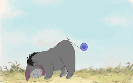 Eeyore tries on a yoyo for a tail.