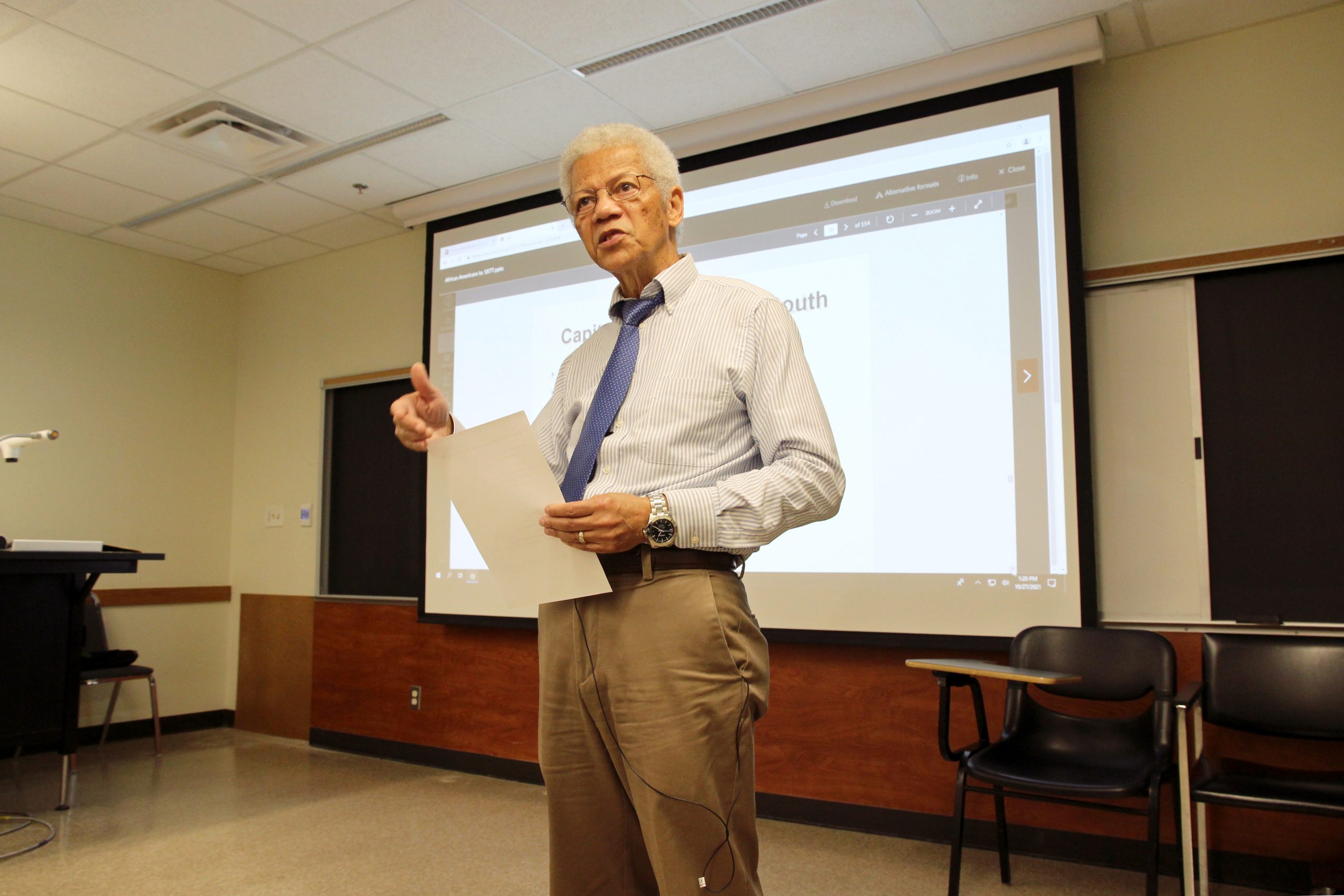 Broussard lectures students on campus.