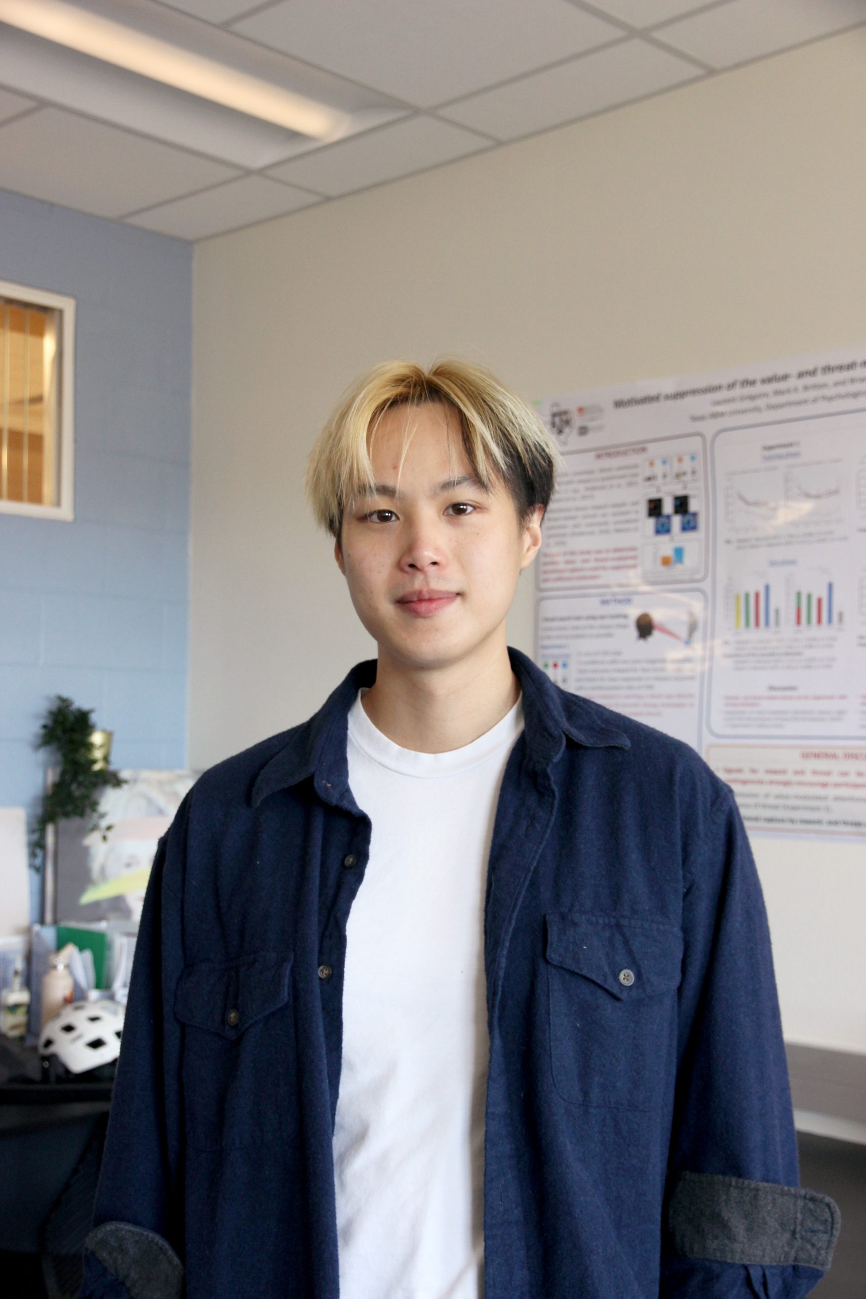 Ming-Ray Liao pauses from his work for a photo in Brian Anderson's lab.