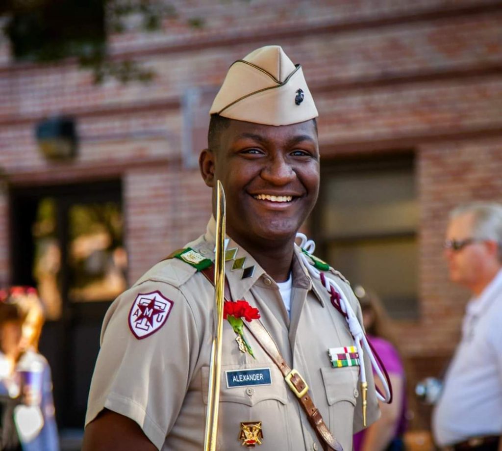 Marquise Alexander smiles for a photo in his corps uniform.