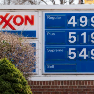 Gas prices at an Exxon are displayed.