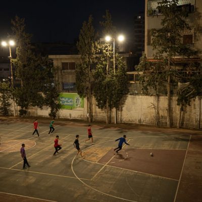 Palestinian youth playing football (known more commonly as soccer in the United States).