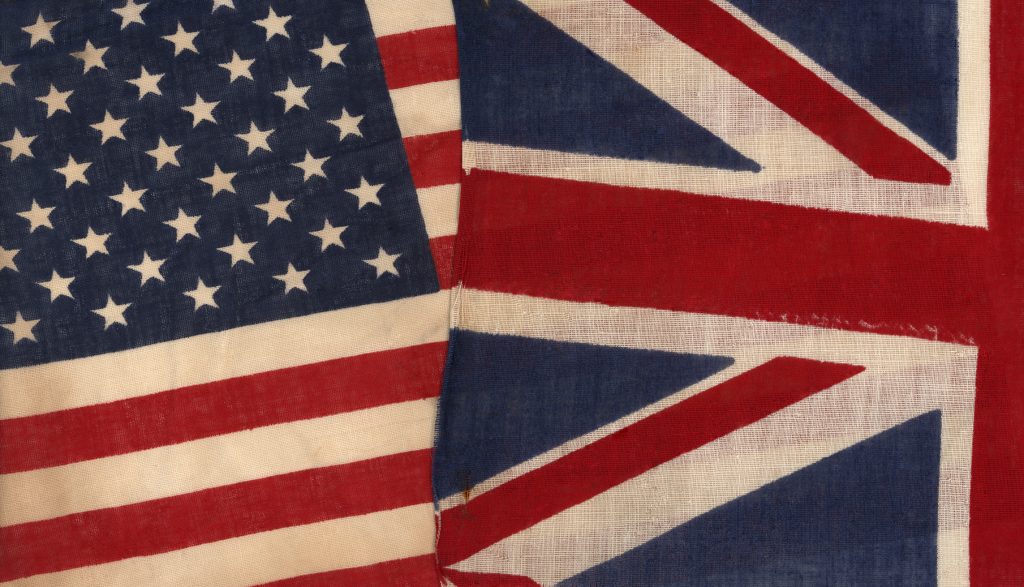 Photo of antique American and British flags.