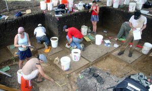workers excavate site in the field