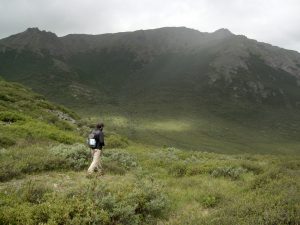 Student walking in remote mountain area